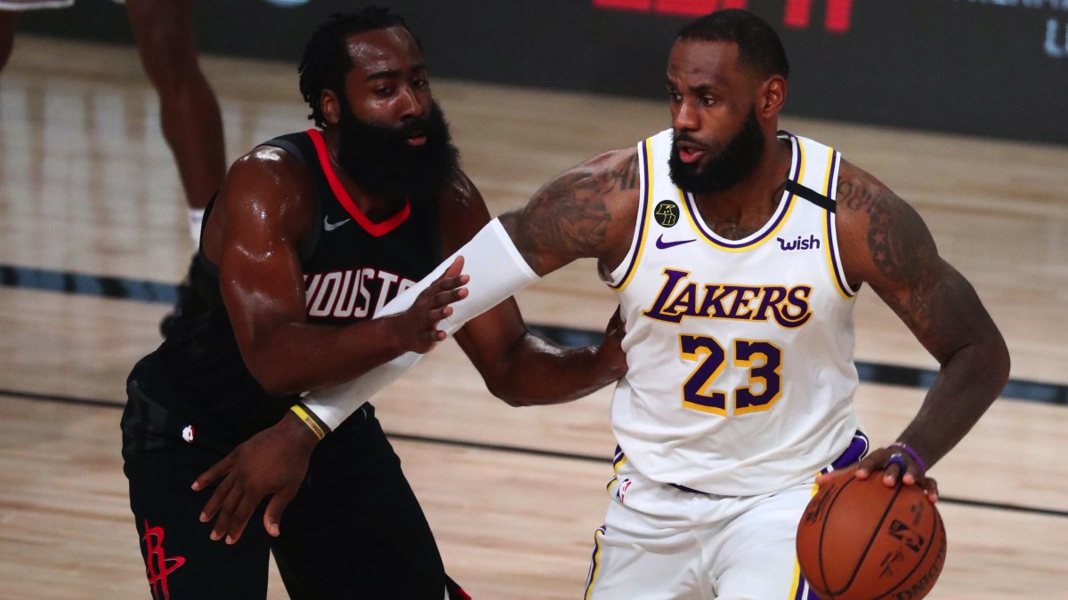 Los Angeles Lakers forward LeBron James (23) dribbles the ball around Houston Rockets guard James Harden (13) in the first half of game five of the second round of the 2020 NBA Playoffs at ESPN Wide W...